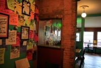 Gig flyers adorn the walls at Cafe Ollie
