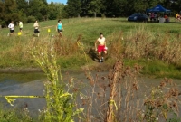 Anne approaches the water crossing at the Farm