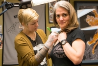 Jen getting the outline of the tattoo on Brenda