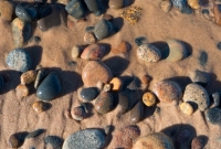 Wind and water tumble stones of Lake Superior at Whitefish Point