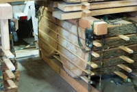 Logs milled into slabs and drying