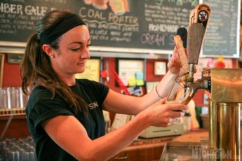 Friendly staff pouring a Goodbye PA at Keweenaw Brewing