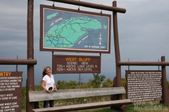 Brenda checking out the West Bluff sign on Brockway Mountain Drive