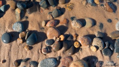 Wind and water tumble stones of Lake Superior at Whitefish Point