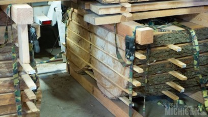 Logs milled into slabs and drying